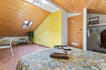 Yellow & Wood Bedroom - Green Building